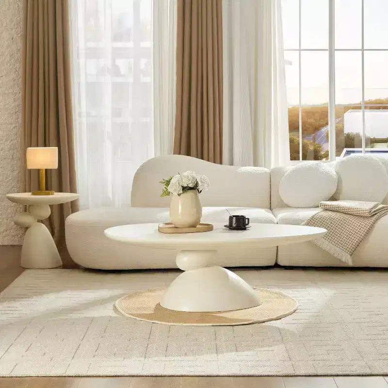 47 Inch Oval Fiberglass Coffee Table with Sculptural Stacked Base, White