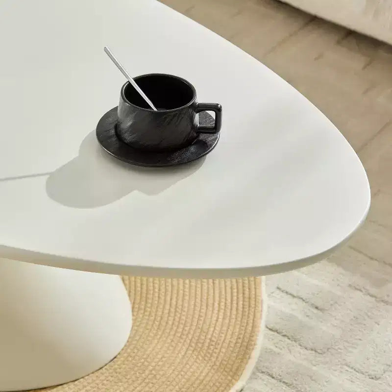 47 Inch Oval Fiberglass Coffee Table with Sculptural Stacked Base, White