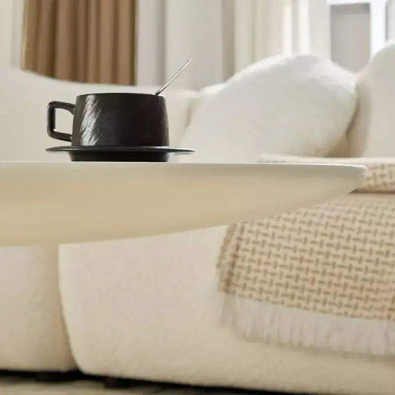 47 Inch Oval Fiberglass Coffee Table with Sculptural Stacked Base, White