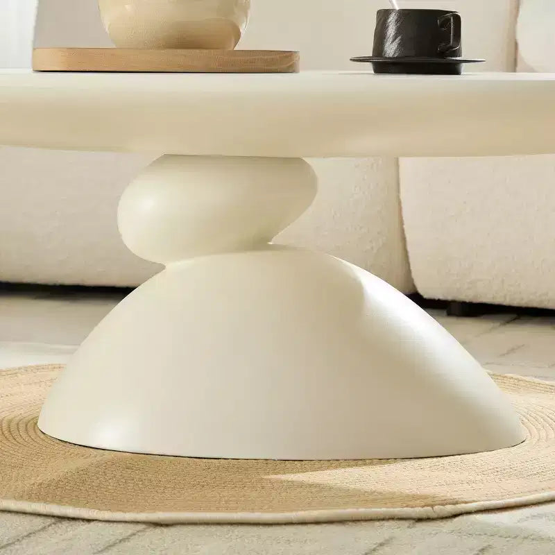 47 Inch Oval Fiberglass Coffee Table with Sculptural Stacked Base, White